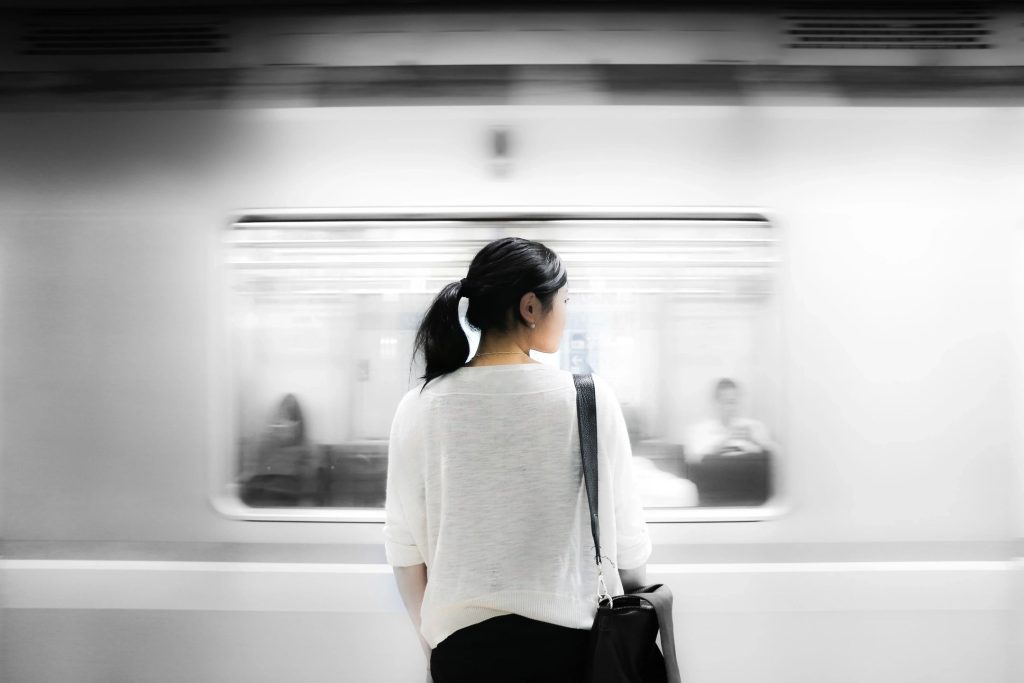 Person watching subway going past